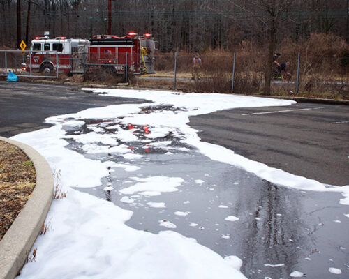 A fire truck is parked on the side of the road.