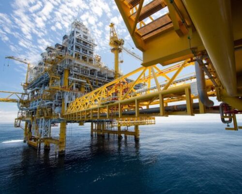 A large yellow and white structure in the ocean.